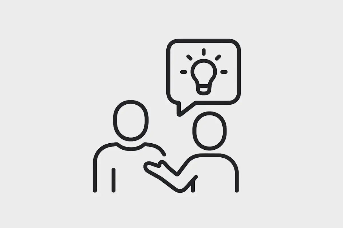 Icoon van twee personen in gesprek waarbij een expert advies en begeleiding geeft aan een zelfbouwer over de installatie van domotica en slimme woning technieken.